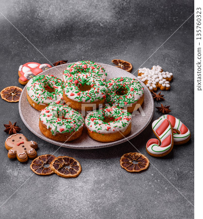 Christmas donuts or doughnuts, holiday winter sweets with sprinkles. Christmas donuts 135760323