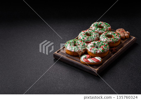 Christmas donuts or doughnuts, holiday winter sweets with sprinkles. Christmas donuts 135760324