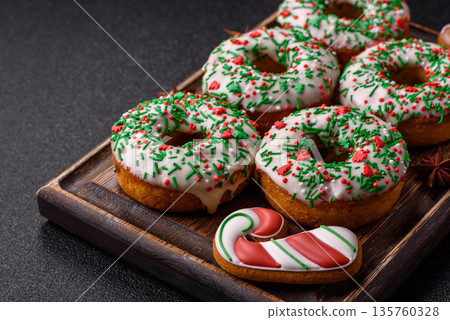 Christmas donuts or doughnuts, holiday winter sweets with sprinkles. Christmas donuts 135760328