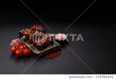 Grilled or bbq pork ribs with sauce, a food prepared for dinner. Grilled ribs Grilled or bbq pork ribs with sauce, a food prepared for dinner. Grilled ribs 135760394