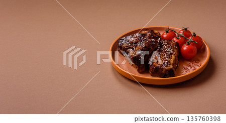 Grilled or bbq pork ribs with sauce, a food prepared for dinner. Grilled ribs 135760398