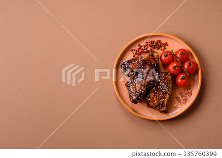Grilled or bbq pork ribs with sauce, a food prepared for dinner. Grilled ribs 135760399