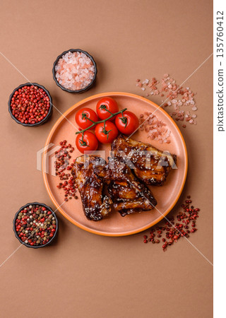 Grilled or bbq pork ribs with sauce, a food prepared for dinner. Grilled ribs 135760412