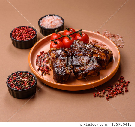 Grilled or bbq pork ribs with sauce, a food prepared for dinner. Grilled ribs 135760413