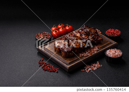 Grilled or bbq pork ribs with sauce, a food prepared for dinner. Grilled ribs Grilled or bbq pork ribs with sauce, a food prepared for dinner. Grilled ribs 135760414