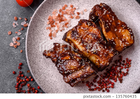 Grilled or bbq pork ribs with sauce, a food prepared for dinner. Grilled ribs 135760435