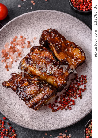 Grilled or bbq pork ribs with sauce, a food prepared for dinner. Grilled ribs 135760436