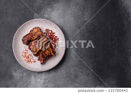Grilled or bbq pork ribs with sauce, a food prepared for dinner. Grilled ribs 135760443