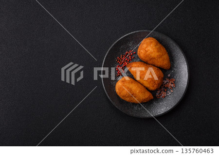 Chicken Kyiv cutlet with buttery filling, a lunch of chicken breast meat. Chicken Kyiv 135760463