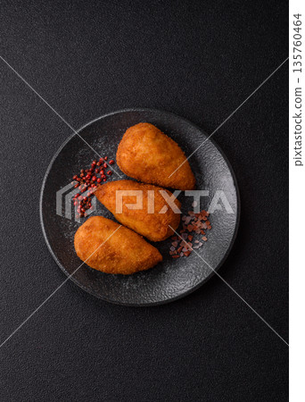 Chicken Kyiv cutlet with buttery filling, a lunch of chicken breast meat. Chicken Kyiv 135760464