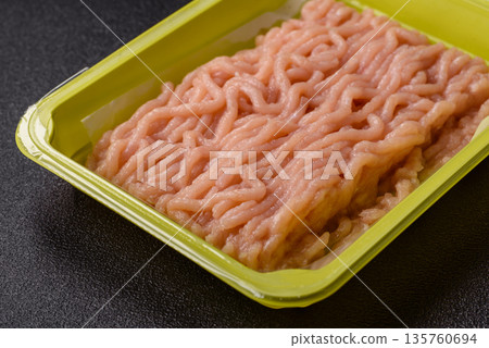 Raw ground chicken for burgers and other food. Raw minced chicken meat 135760694
