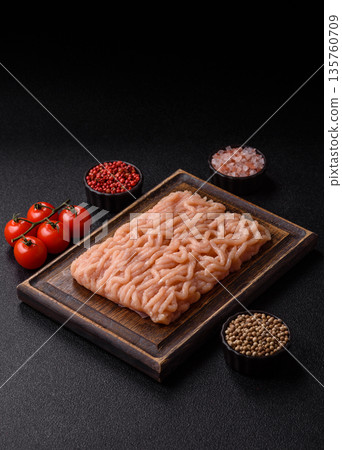 Raw ground chicken for burgers and other food. Raw minced chicken meat Raw ground chicken for burgers and other food. Raw minced chicken meat 135760709