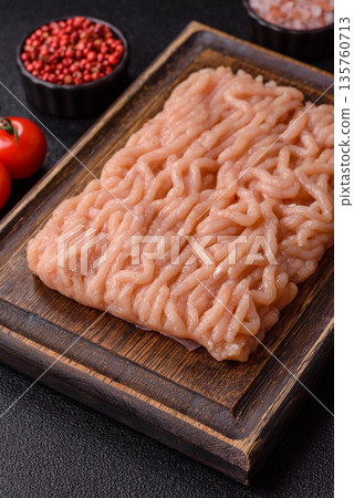 Raw ground chicken for burgers and other food. Raw minced chicken meat 135760713