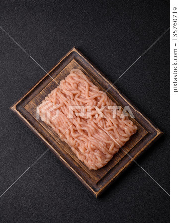 Raw ground chicken for burgers and other food. Raw minced chicken meat Raw ground chicken for burgers and other food. Raw minced chicken meat 135760719