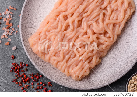 Raw ground chicken for burgers and other food. Raw minced chicken meat Raw ground chicken for burgers and other food. Raw minced chicken meat 135760728