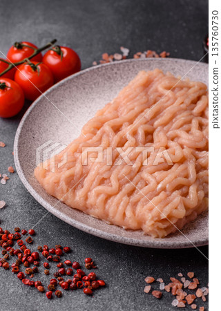 Raw ground chicken for burgers and other food. Raw minced chicken meat Raw ground chicken for burgers and other food. Raw minced chicken meat 135760730