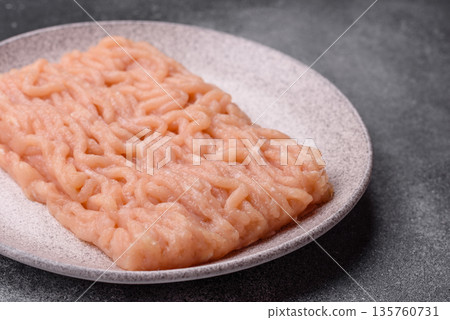 Raw ground chicken for burgers and other food. Raw minced chicken meat Raw ground chicken for burgers and other food. Raw minced chicken meat 135760731