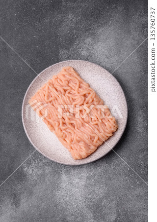 Raw ground chicken for burgers and other food. Raw minced chicken meat 135760737