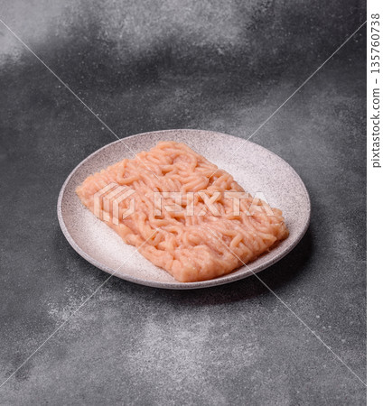 Raw ground chicken for burgers and other food. Raw minced chicken meat Raw ground chicken for burgers and other food. Raw minced chicken meat 135760738