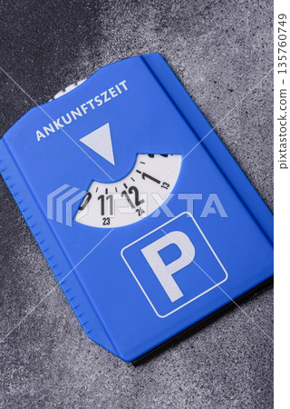 A parking disc, permit, or ticket for measuring time and paying municipal services. A parking disc A parking disc, permit, or ticket for measuring time and paying municipal services. A parking disc 135760749