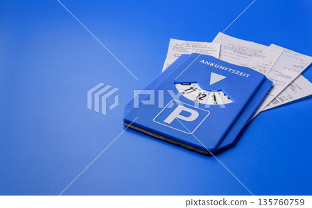 A parking disc, permit, or ticket for measuring time and paying municipal services. A parking disc 135760759