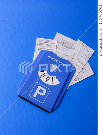 A parking disc, permit, or ticket for measuring time and paying municipal services. A parking disc A parking disc, permit, or ticket for measuring time and paying municipal services. A parking disc 135760761