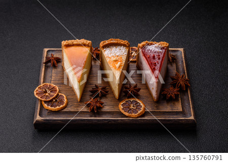 Cheesecake, a slice of sweet pie, a classic cheese dessert. Cheesecake as a food background Cheesecake, a slice of sweet pie, a classic cheese dessert. Cheesecake as a food background 135760791