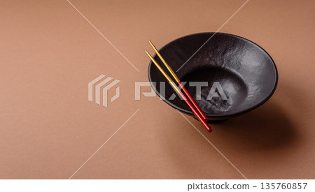 An empty round ceramic plate on a table, kitchenware. An empty plate An empty round ceramic plate on a table, kitchenware. An empty plate 135760857