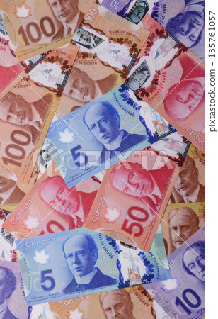 Money, currency of Canada, dollar banknotes of various denominations. Canadian money Money, currency of Canada, dollar banknotes of various denominations. Canadian money 135761057