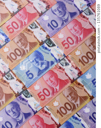 Money, currency of Canada, dollar banknotes of various denominations. Canadian money Money, currency of Canada, dollar banknotes of various denominations. Canadian money 135761089