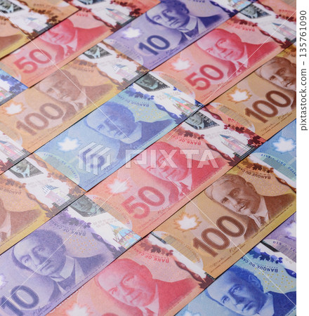 Money, currency of Canada, dollar banknotes of various denominations. Canadian money Money, currency of Canada, dollar banknotes of various denominations. Canadian money 135761090