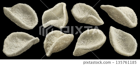 Japanese prawn crackers isolated on black background, traditional Asian restaurant snack, full depth of field 135761185