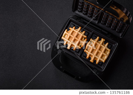 Belgian waffles, a healthy sweet breakfast dessert, food background. Belgian waffles Belgian waffles, a healthy sweet breakfast dessert, food background. Belgian waffles 135761186