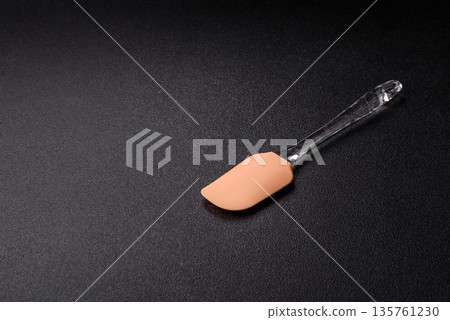 Spatula, silicone kitchen utensils for cooking and baking at home. Silicone spatula Spatula, silicone kitchen utensils for cooking and baking at home. Silicone spatula 135761230