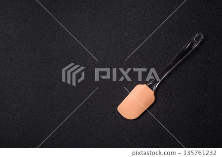 Spatula, silicone kitchen utensils for cooking and baking at home. Silicone spatula Spatula, silicone kitchen utensils for cooking and baking at home. Silicone spatula 135761232
