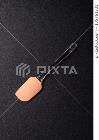 Spatula, silicone kitchen utensils for cooking and baking at home. Silicone spatula Spatula, silicone kitchen utensils for cooking and baking at home. Silicone spatula 135761233