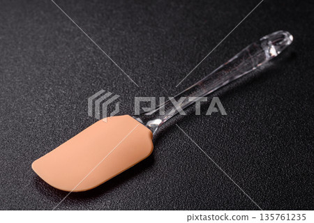 Spatula, silicone kitchen utensils for cooking and baking at home. Silicone spatula Spatula, silicone kitchen utensils for cooking and baking at home. Silicone spatula 135761235