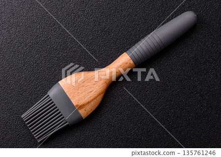 Brush, silicone kitchen utensils for cooking and baking at home. Silicone brush Brush, silicone kitchen utensils for cooking and baking at home. Silicone brush 135761246
