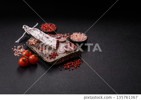 Dry Spanish salami sausage fuet as a snack for the dinner table. Fuet sausage 135761367