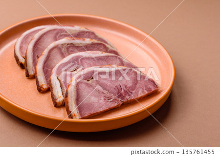 A meat roll made from pork or beef tongue slices with spices. Tongue roll A meat roll made from pork or beef tongue slices with spices. Tongue roll 135761455