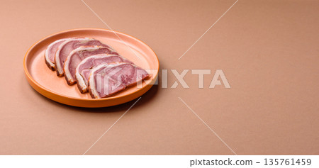 A meat roll made from pork or beef tongue slices with spices. Tongue roll A meat roll made from pork or beef tongue slices with spices. Tongue roll 135761459