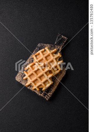 Belgian waffles, a healthy sweet breakfast dessert, food background. Belgian waffles Belgian waffles, a healthy sweet breakfast dessert, food background. Belgian waffles 135761480