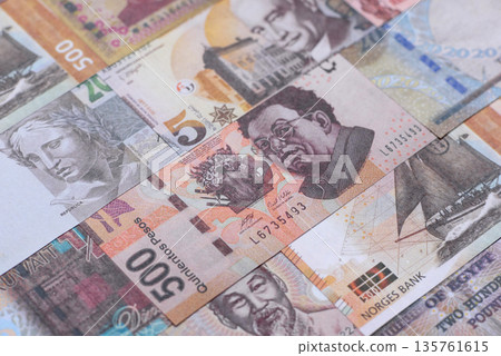 Money background, currency exchange, paper banknotes from different countries. Money cash currency Money background, currency exchange, paper banknotes from different countries. Money cash currency 135761615