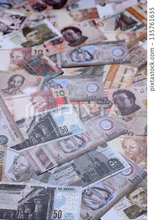 Money background, currency exchange, paper banknotes from different countries. Money cash currency Money background, currency exchange, paper banknotes from different countries. Money cash currency 135761635