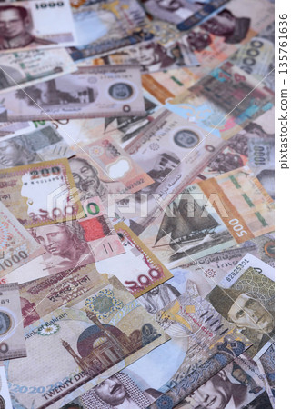 Money background, currency exchange, paper banknotes from different countries. Money cash currency Money background, currency exchange, paper banknotes from different countries. Money cash currency 135761636
