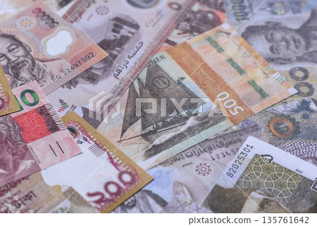 Money background, currency exchange, paper banknotes from different countries. Money cash currency Money background, currency exchange, paper banknotes from different countries. Money cash currency 135761642