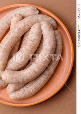 Raw pork or chicken meat sausages for grilling, a spicy picnic food. Raw sausages 135761687