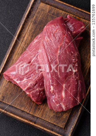 Raw meat, fresh beef tenderloin or filet mignon for grilling. Raw beef tenderloin Raw meat, fresh beef tenderloin or filet mignon for grilling. Raw beef tenderloin 135761699
