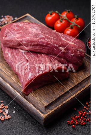 Raw meat, fresh beef tenderloin or filet mignon for grilling. Raw beef tenderloin Raw meat, fresh beef tenderloin or filet mignon for grilling. Raw beef tenderloin 135761704