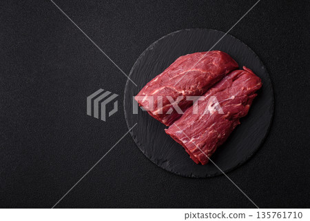Raw meat, fresh beef tenderloin or filet mignon for grilling. Raw beef tenderloin Raw meat, fresh beef tenderloin or filet mignon for grilling. Raw beef tenderloin 135761710